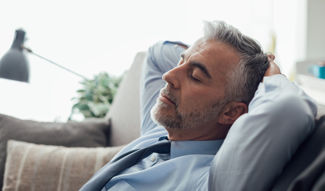 businessman-sleeping-on-the-couch-2021-08-26-22-39-58-utc
